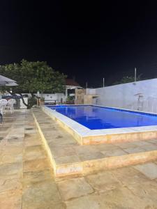 a large swimming pool at night with at Casa Beach park in Aquiraz