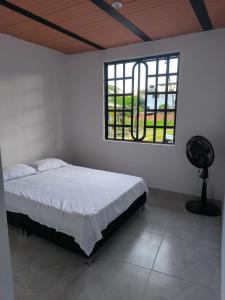 Кровать или кровати в номере Apartamento en Villavicencio