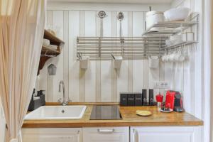 a kitchen with a sink and a counter top at Olive Garden Loft Relax among Olive Trees and Gazebos in Florence
