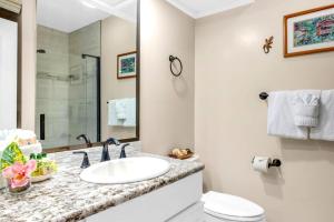 a bathroom with a sink and a toilet and a mirror at NEW KBM Resorts FREE CAR Kapalua Golf Villas 1-Bedroom Condo with Spacious Lanai and Golf Course Views KGV-18T4 in Kapalua +33 photos