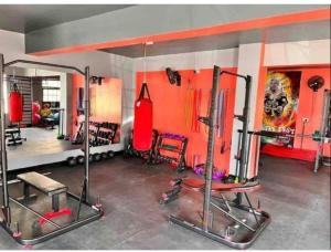 a room with a gym with two tread machines at SarafuDeluxe in Nakuru