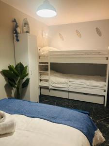 a bedroom with two bunk beds in it at Duin 10 in Katwijk aan Zee