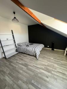 Ένα ή περισσότερα κρεβάτια σε δωμάτιο στο Chambre circuit des 24 heures