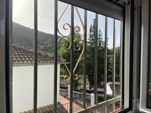 a view from a window with a view of a mountain at Feel Nature en La Casa de la Desconexión in Benamahoma