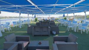 a group of tables and chairs under a tent at M/S Royal Adventure - Saturday from Luxor 4 or 7 Nights - Wednesday from Aswan 3 or 7 Nights in Luxor