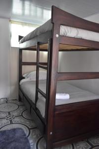 a couple of bunk beds in a room at La posada de Martha in Marulanda