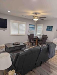 a living room with a couch and a table at Alpine's Gorgeous Guest Home in Alpine