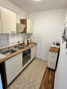 Η κουζίνα ή μικρή κουζίνα στο Skyline & Tollwood Apartment