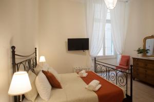 Postel nebo postele na pokoji v ubytování Dimora San Siro + 12 fotografií