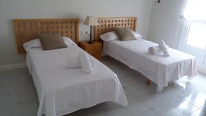 Postel nebo postele na pokoji v ubytování Luxury Beach House