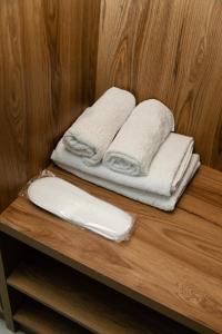 a couple of towels are sitting on a shelf at Hotel Graif Ti in Tbilisi City