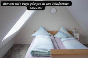Ένα ή περισσότερα κρεβάτια σε δωμάτιο στο Haus Ambiente