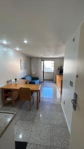 a living room with a table and a couch at 1506 - Blue Tree Towers in Fortaleza