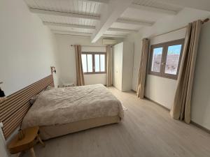 a bedroom with a large bed and a large window at Villa Mamina Martinique in Fort-de-France +45 photos