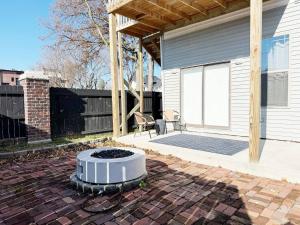 a patio with a fire pit in front of a house at The Washington Apartments in Evansville