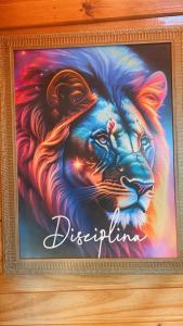 a picture of a painting of a lion at Cabanas da Faby in Canela