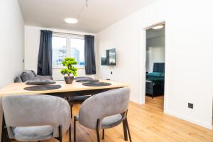 a dining room with a table and chairs at Luxapartment l Krivá in Košice