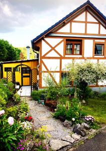 a house with a garden in front of it at Landhaus-Villa, Sauna, private Garten in Schleiden