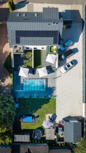 an overhead view of a building with a parking lot at Bala-Home Apartments & Pool in Balatonboglár