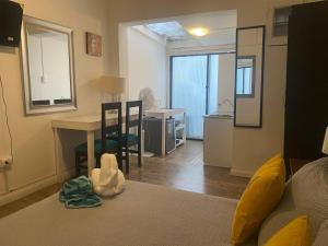 a living room with a table and a dining room at Home Estudio 3 in Santiago