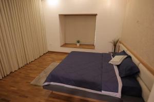 a room with a bed and a window at Mon Reve Holidays in Kozhikode
