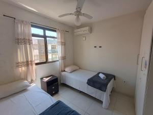 Ένα ή περισσότερα κρεβάτια σε δωμάτιο στο Cobertura duplex na praia do morro