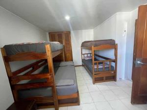 a small room with two bunk beds in it at Alojamientovacacional657 in Rodadero