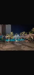 a view of a swimming pool at night at Gav resort in Salinópolis