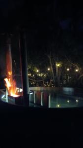 a fire pit in a park at night at Espacio Arenales in Paine