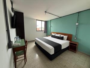 Postel nebo postele na pokoji v ubytování Hotel Royalty