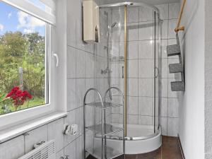 a bathroom with a shower with a glass door at Nelson in Jabel +22 photos