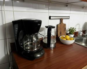 a coffee maker on a counter in a kitchen at Santiago de las alturas in Santiago