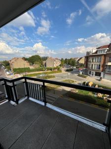 a balcony with a view of a street at Luxury 1 Bedroom Apartment with Sofa Bed & Balconies Prime Location near ING Arena, Expo 12 & Atomium in Wemmel