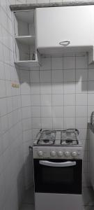O bucătărie sau chicinetă la Quarto individual em apto compartilhado +8 fotografii