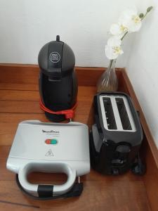 a mixer and a toaster sitting on a table at Appartement MANBANA 320 - accès direct a la plage in Grand-Bourg
