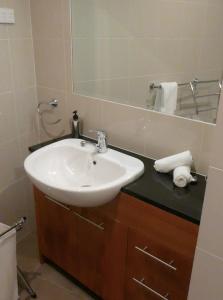 a bathroom with a sink and a mirror at The Peak 202 in Mount Buller +42 photos