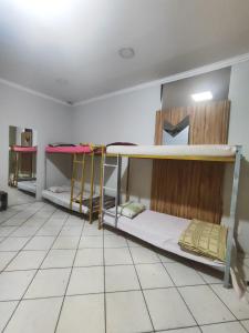 Ένα ή περισσότερα κρεβάτια σε δωμάτιο στο Pousada Nova Jerusalém