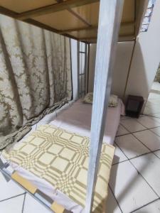 Ένα ή περισσότερα κρεβάτια σε δωμάτιο στο Pousada Nova Jerusalém