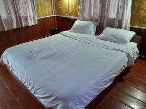 Ένα ή περισσότερα κρεβάτια σε δωμάτιο στο Sainamhai Resort