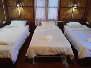 Ένα ή περισσότερα κρεβάτια σε δωμάτιο στο Sainamhai Resort