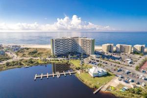 an aerial view of a resort on the beach at A Wave From It All at Pinnacle Port in Carillon Beach