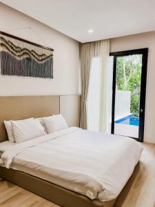 Postel nebo postele na pokoji v ubytování JK Bhavana Villas + 74 fotografií