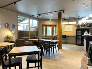 a restaurant with tables and chairs in a room at RONENAI BASE - Vacation STAY 70576v in Shibinai