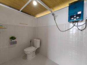a bathroom with a toilet and a blue cabinet at ชาเลต์ ภูทับเบิก in Ban Maeo Thap Boek +2 photos