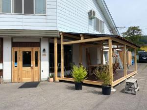 a house with a screened in porch on it at RONENAI BASE - Vacation STAY 70567v in Shibinai