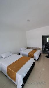 Ένα ή περισσότερα κρεβάτια σε δωμάτιο στο Casa Hotel Villa Sabrosura +1 φωτογραφίες