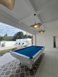 a billiard room with a pool table in a house at Villa Ramos in Tangkubanperahu