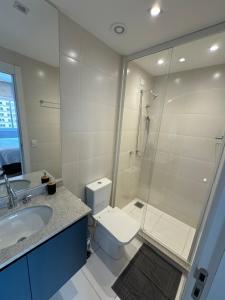 a bathroom with a shower and a toilet and a sink at Studio Luxo JH 706 Best Location in Gleba - 1 Quarto in Londrina