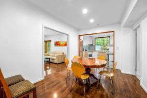 a dining room with a table and chairs at Relaxing Ringwood Getaway near Mullum Mullum Trail in Ringwood