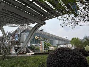 a view of a building in a park at WAIFIDEN Guangzhou Grand View Golden Palace Apartment in Guangzhou